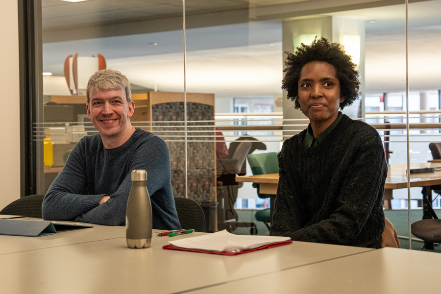 Arthur Bahr and Jessica Ruffin seated side-by-side at a table