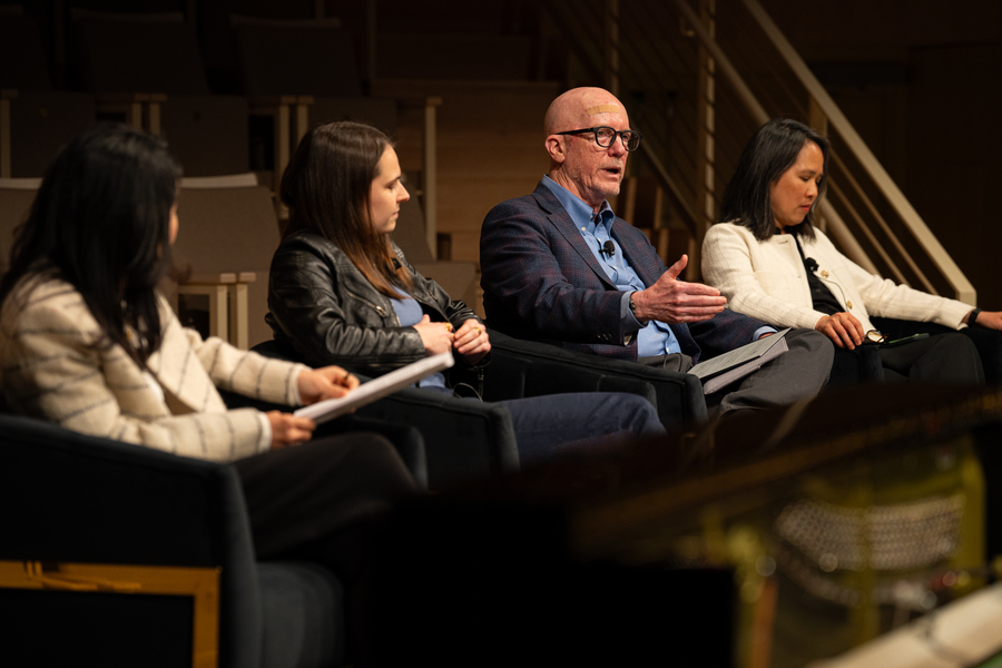 Songyee Yoon, Bailey Flanigan, Charles Stewart III, and Lily Tsai on a panel indoors, with Stewart speaking and gesturing