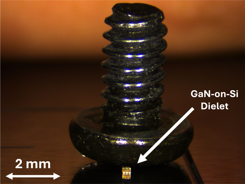 A small golden metal at the bottom of a screw flipped upside down for comparison. An arrow of 2mm indicates the small size of the metal, labeled as “Gan-on-Si dielet.”