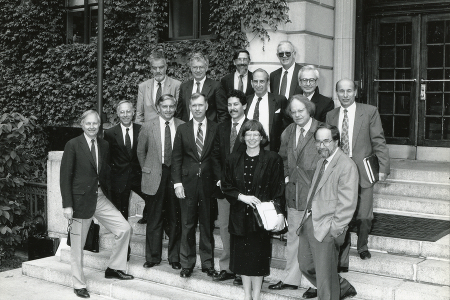 Black-and-white photo of 15 people standing on outdoor steps. Harriet Latham Robinson is the sole woman in the image.