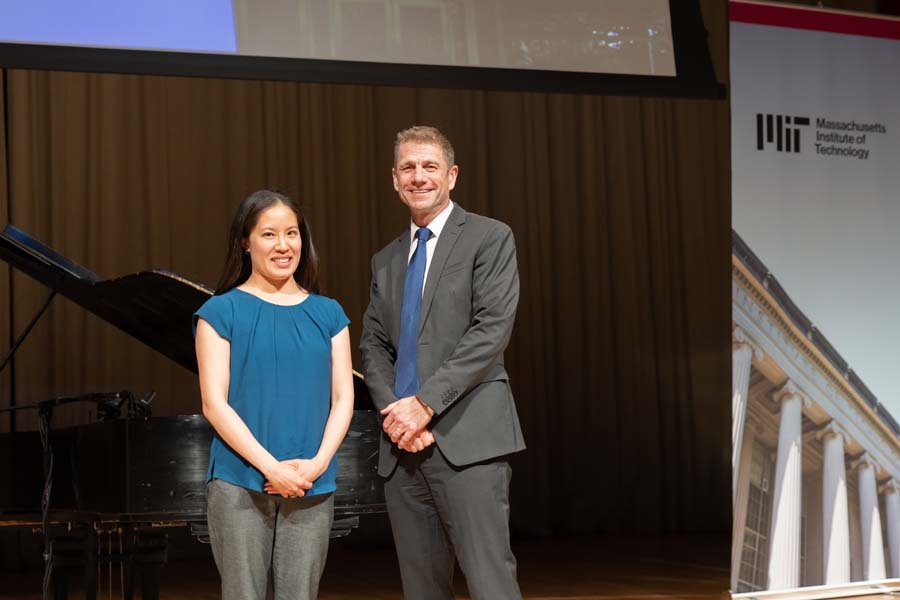 Allison Chang and Justin Brooke stand together on stage.