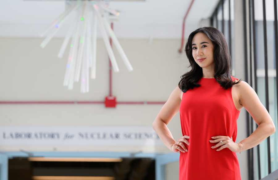Jessica Fry stands in the bright atrium of the LNS