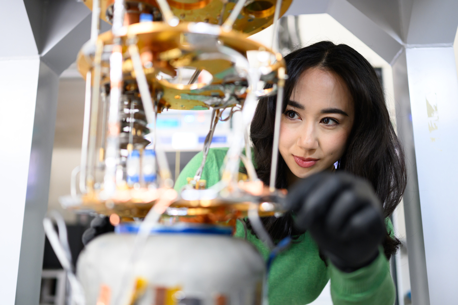 Close-up of Jessica Fry tending an experiment in the lab, with only her face in focus