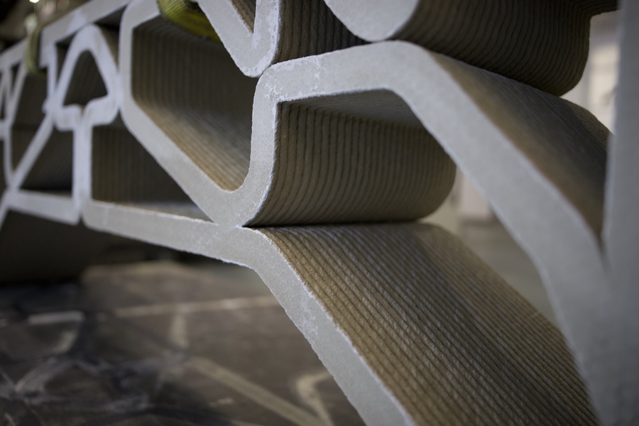 Close up of intricate spider-web like design of concrete bridge shows ridges on the flat surfaces