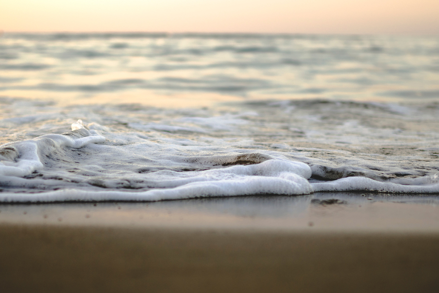 Ocean waves on a sandy shore