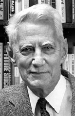 Headshot of Claude Shannon as an older man in front of a bookcase