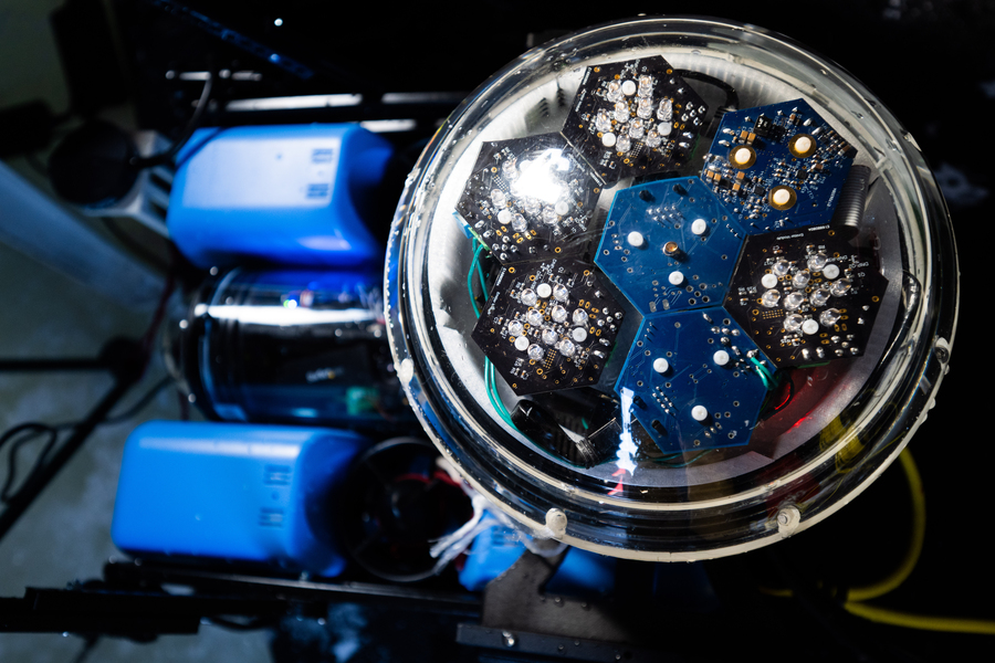 A communications device enclosed in a clear vessel has hexagon-structures containing sensors.