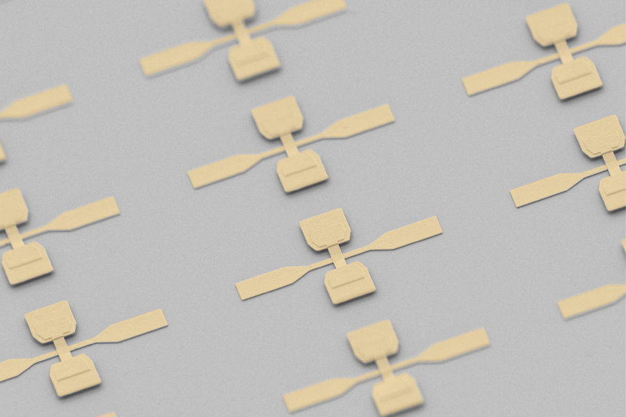  An array of the devices, which look like two crossed paddles creating a “t.” 