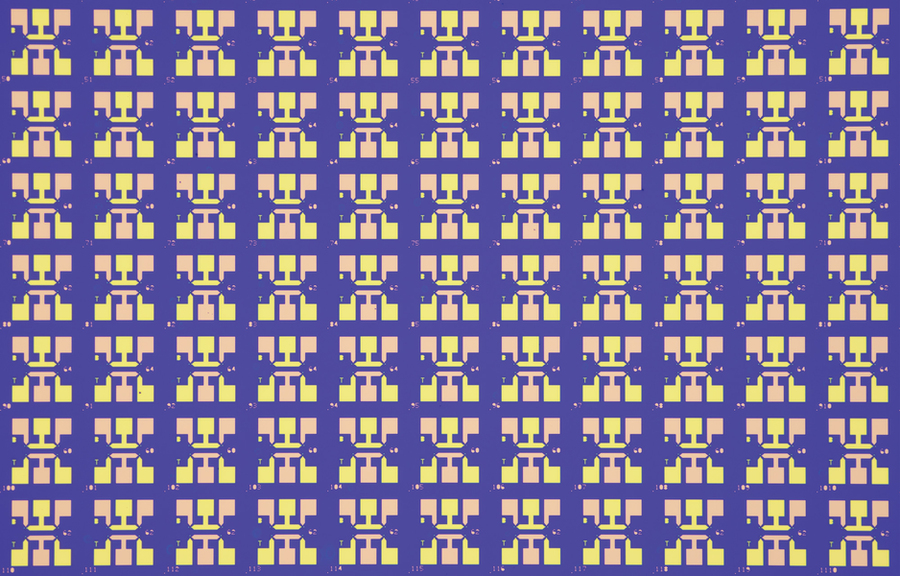 Extreme closeup of a chip shows a grid of blocky “X”-shaped parts.