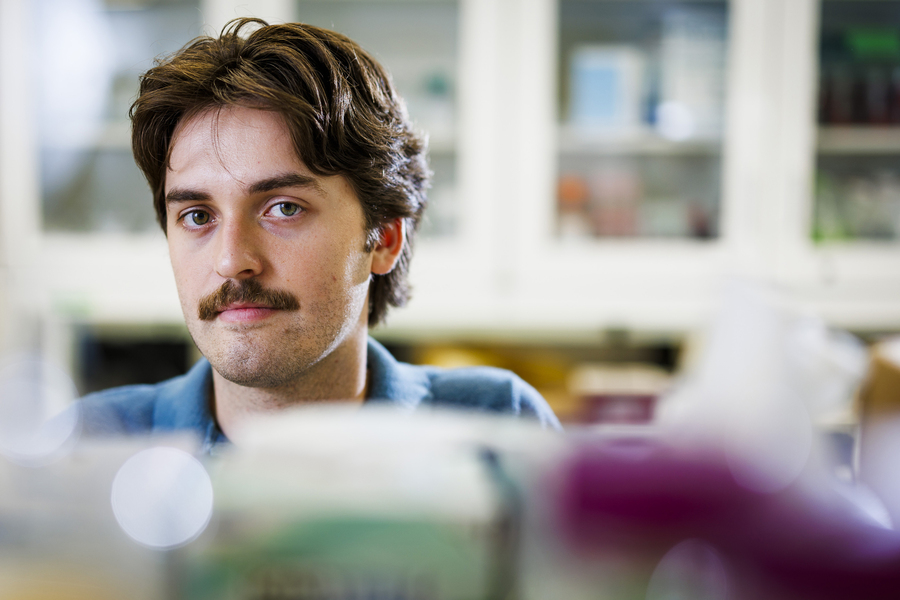 Closeup portrait of Gage Coon in lab.