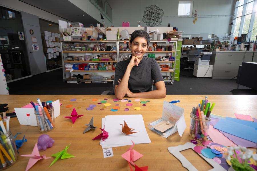 Ila Kumar portrait, seated at a table with craft supplies.