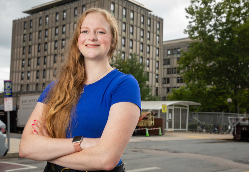Sydney Baller poses in front of MIT's McCormick Hall 