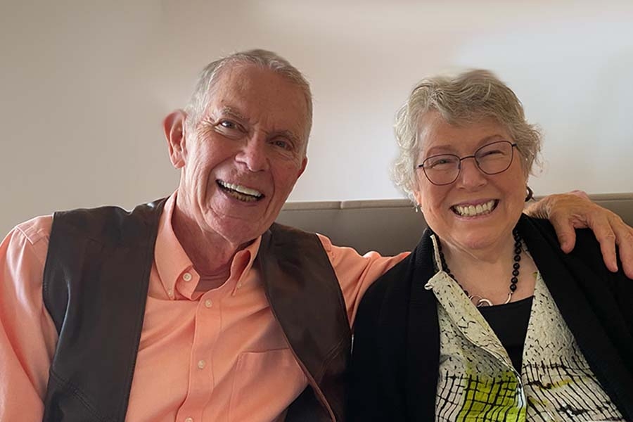 James Poitras and Patricia Poitras, seated on a couch