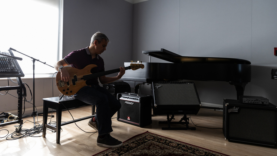 Paris Smaragdis holding a guitar