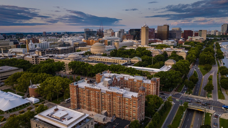 Low-altitude aerial view of MIT campus buildings and roads