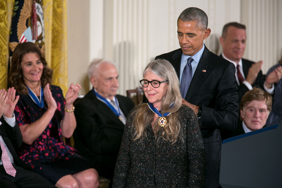 Barack Obama pins a Presidential Medal of Freedom on Margaret Hamilton while other winners, seated, applaud