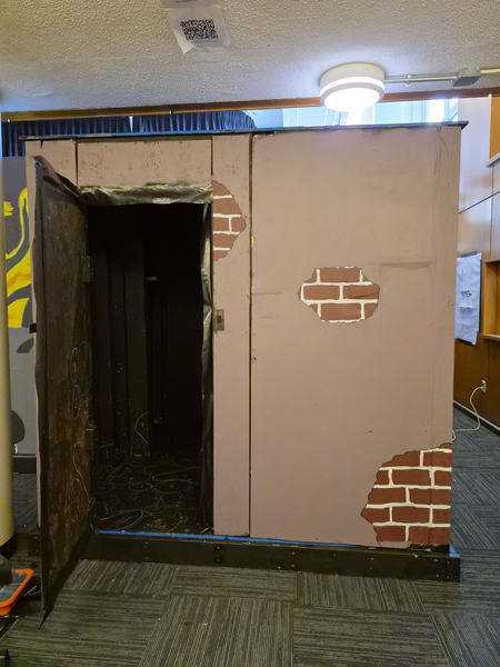 A door to escape room has Velcro closures for saftey.