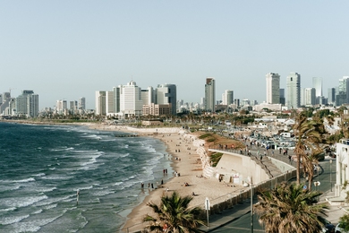 Photo of the beach and city skyline of Tel Aviv, Israel