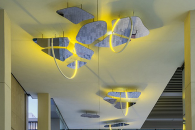 Photo of Northwest Passage, an art installation at MIT.nano. It’s basically a ceiling with some holes in it, and illuminated loops through the holes.