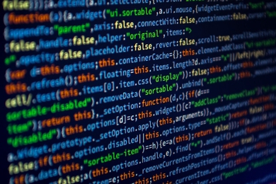 Image of multicolored computer code text on a black screen