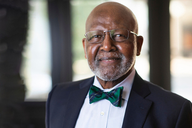 Photo of Wes Harris wearing a suit and a bow tie.