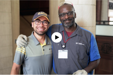 MIT employees embrace for a photo