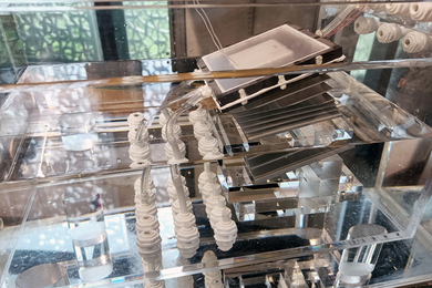 research papers on artificial intelligence and ipr A desalinization prototype, a clear rectangular box with water, tubes and a square spring, setup in the lab