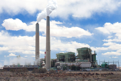 research papers on artificial intelligence and ipr Photo of a power plant with two smokestacks in a desert area on a partly cloudy day
