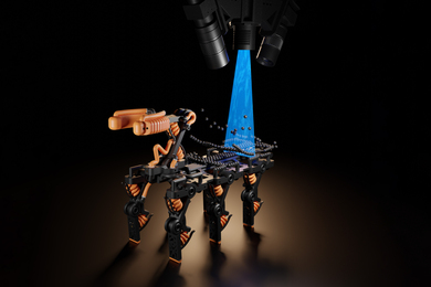 Rendering shows a six-legged robot, standing against a black background, in the process of being 3D-printed. Near the back of the robot, floating black spheres are assembled and then cured by a blue UV light beaming down from above. On top, cameras point down to scan the action.