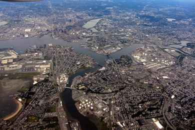 Aerial photo of Boston suburbs. East Boston and Logan Airport are in the foreground.