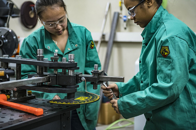mit thesis on thermal energy storage Two young women in teal safety jumpsuits work together in a machine shop
