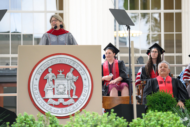 MIT president Sally Kornbluth speaking at MIT’s Commencement at podium.