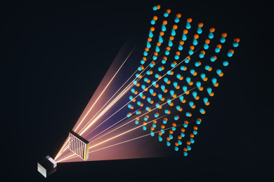 Graphic showing light emanating from a cubic crystal and passing through a material with an array of square holes. A lattice of atoms appears on the other side