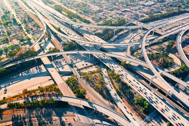 An aerial view of a complex highway interchange in Los Angeles.