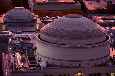 Aerial photo of MIT domes bathed in pink sunlight