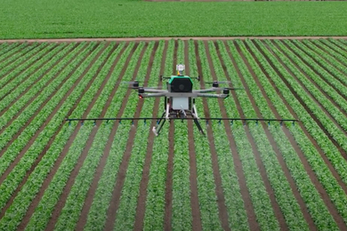 A large drone delivering supplies to a mountainous location
