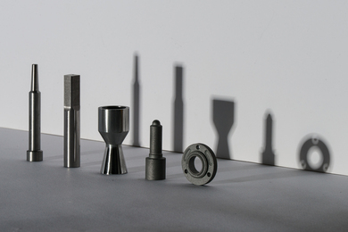 Five metal attachments for tools
