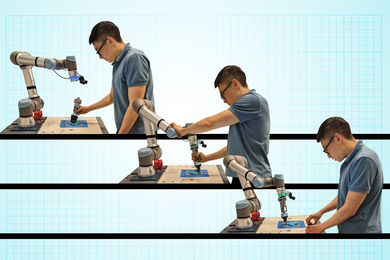 A person teaching a robot new skills with a handheld device