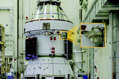 A photo of the Artemis II spacecraft is a spacecraft hangar, with an inset of the boxy MAScOT terminal.