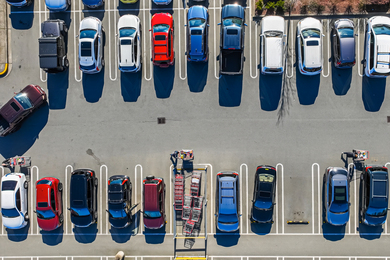 Aerial view of a parking lot with few open spaces