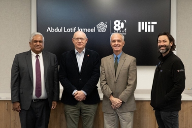 Anantha Chandrakasan, Bruce Currie, Jim Collins and Alex Shalek in front of a black screen displaying logos
