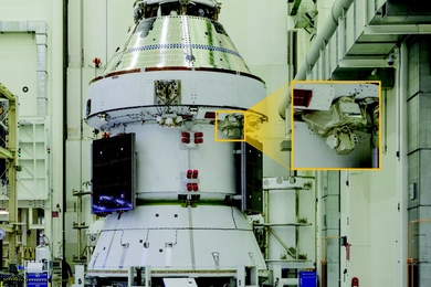 Photo of an Orion spacecraft inside a cleanroom. A callout box outlines where a laser communications terminal is on the spacecraft.