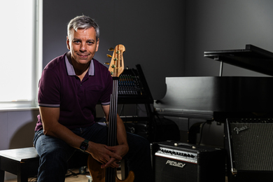 Paris Smaragdis holding a guitar
