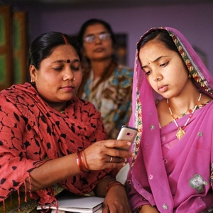 women looking at cellphone