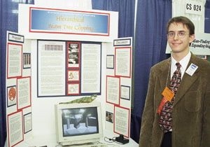 Geoffrey Schmidt with the exhibit for his prize-winning project at the Intel International Science and Engineering Fair.