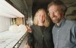 Professor of Biology Graham C. Walker (right) and postdoctoral fellow Kristin D. Levier show alfalfa they grew for research on bacteria that affect alfalfa and cause brucellosis.