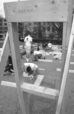 Students and staff volunteering for Habitat for Humanity built frames next to the Student Center for houses that will eventually appear in Roxbury and elsewhere.