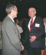 President Charles Vest (left) talks with Norman B. Duffet (SB 1940) in between Tech Day speakers in Kresge Auditorium.