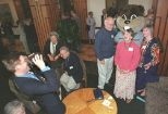Ted Johnson (left) of the Campus Activities Complex takes a photo of retirement dinner guests. Posing with the MIT beaver mascot are (left to right) Professor of Literature Travis Merritt; Nita Regnier, instructor in the Program in Writing and Humanistic Studies; and Bonnie Walters, associate dean in the Office of Academic Services.