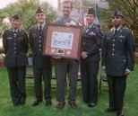 The Paul Revere Battalion won the Most Outstanding ROTC Unit Award, presented in a ceremony last week. Showing the award are several cadets and their trainer. Left to right: Michaele Mandulak of Wellesley; Jared Levant of Tufts; LtC. (Ret.) Robert R. Rooney, who received a gift of thanks from the cadets; Danielle Boudreau of Harvard; and Ishwar Sivakumar, a senior in electrical engineering and com...